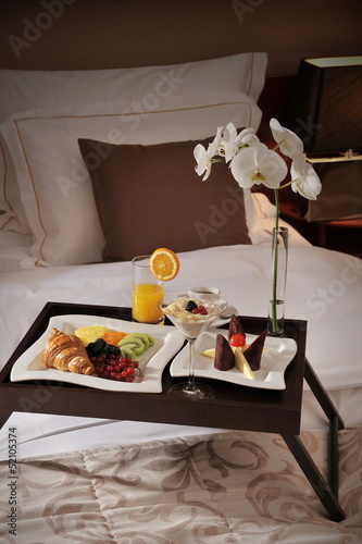 Breakfast in bed at a luxury hotel room