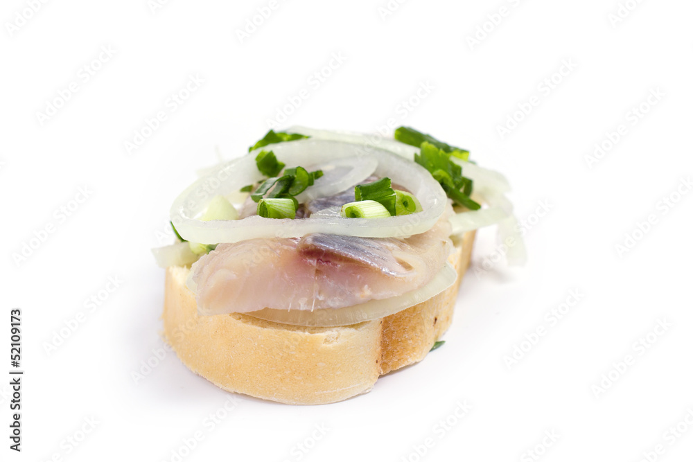 Sandwiches  with herring, onions and herbs on white background