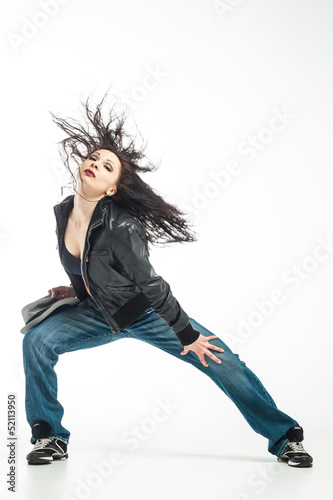 Brunett dancer. Woman dancing in a studio