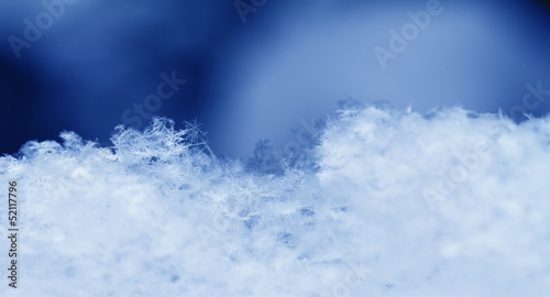 Snowflake in blue snow © Nneirda