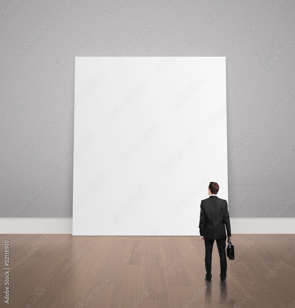 man looking at poster man looking at poster