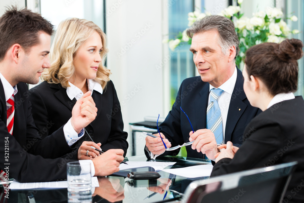 Business people - meeting in an office Business people - meeting in an office