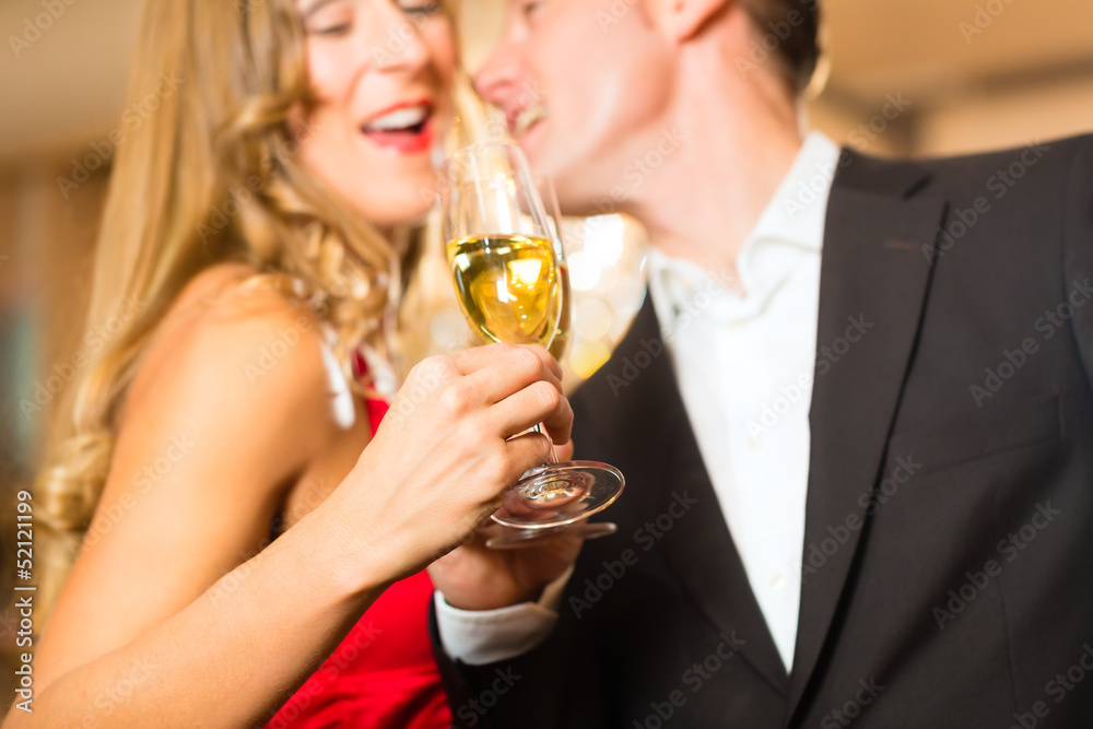 Man and woman tasting Champagne in restaurant Man and woman tasting Champagne in restaurant