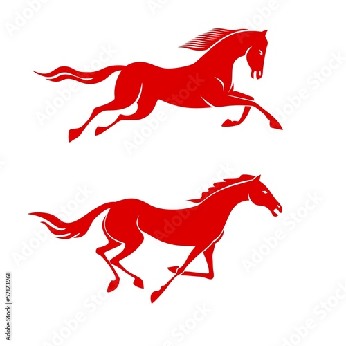 silhouettes of running horses