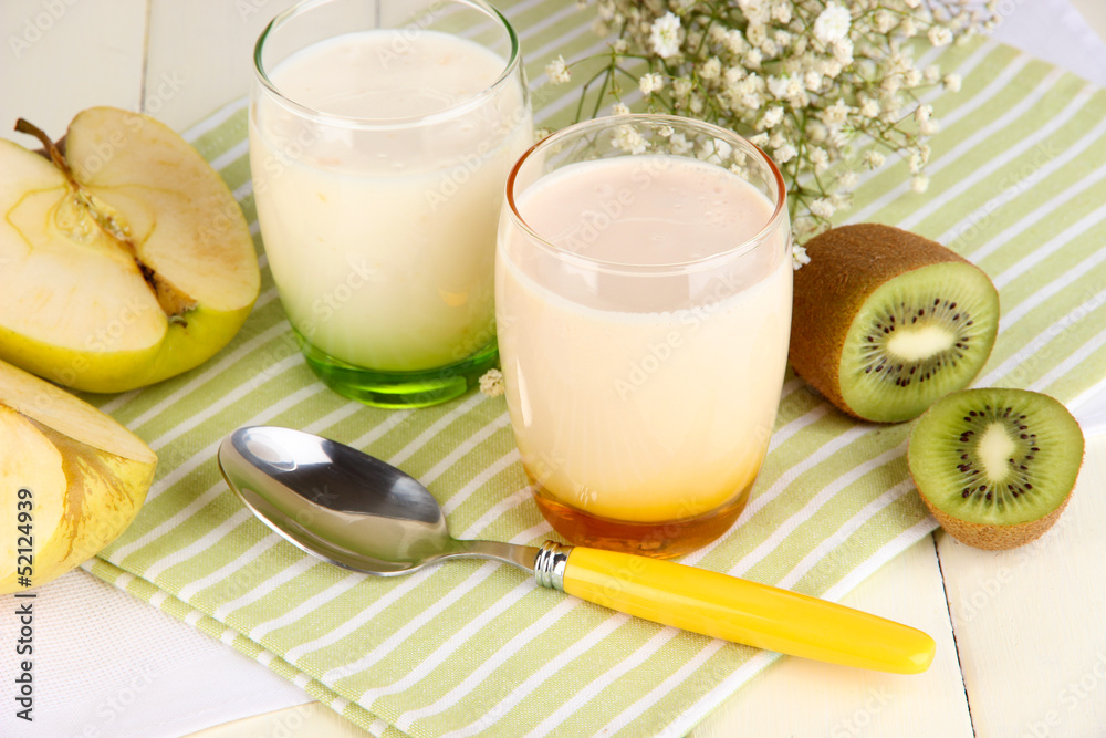 Delicious yogurts with fruits in glasses Delicious yogurts with fruits in glasses