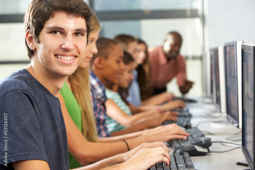 Group Of Students Working At Computers In Classroom Group Of Students Working At Computers In Classroom