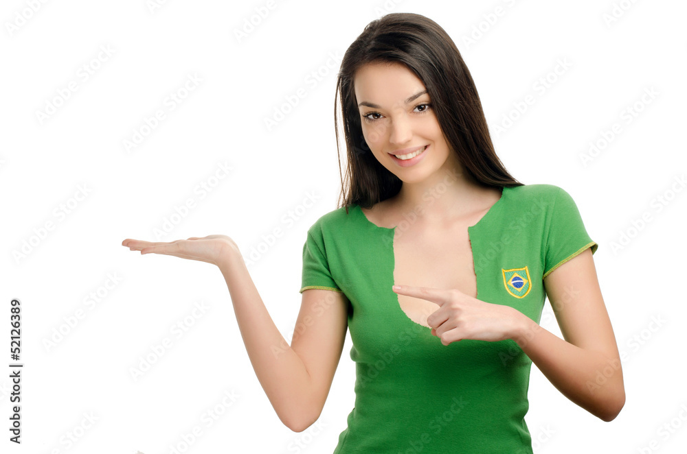 Sexy girl with Brazilian flag on her shirt pointing and showing. Sexy girl with Brazilian flag on her shirt pointing and showing.