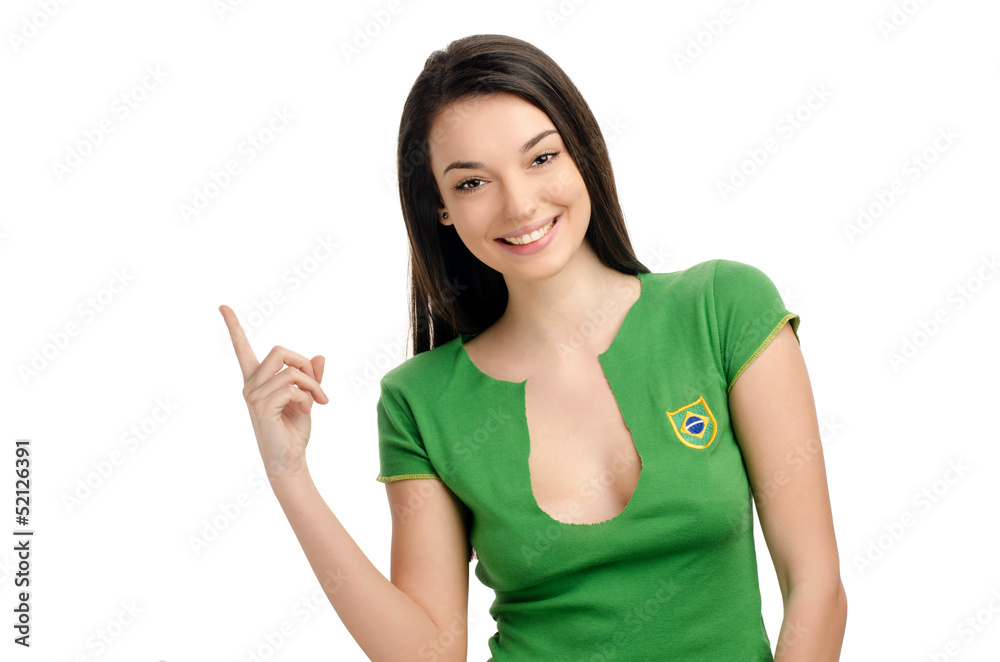 Sexy girl with Brazilian flag on her shirt pointing up. Sexy girl with Brazilian flag on her shirt pointing up.