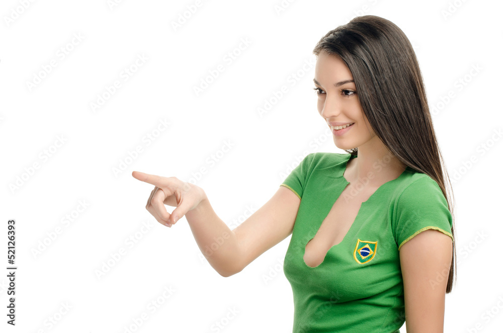 Sexy girl with Brazilian flag on her shirt pointing in front. Sexy girl with Brazilian flag on her shirt pointing in front.