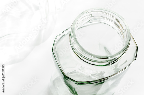Transparent glass jars on white, with high-key effect