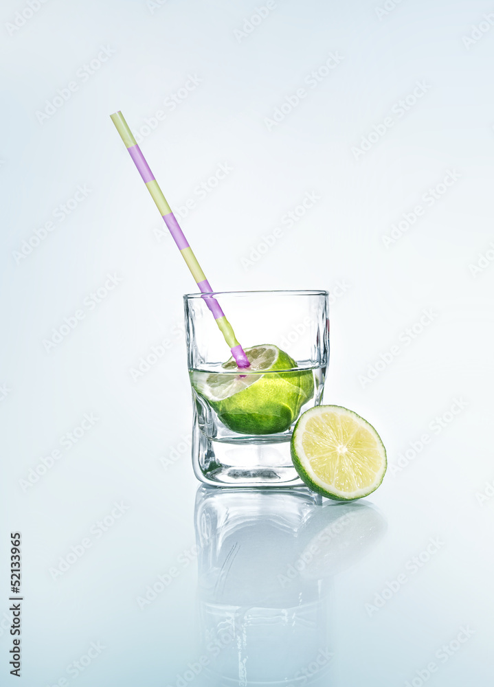 Vodka with lemon - lime and drinking straw Vodka with lemon - lime and drinking straw
