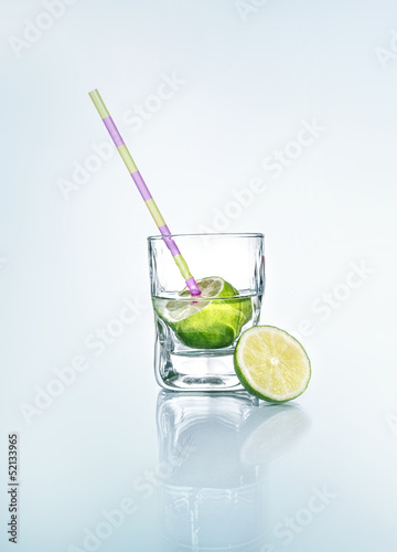 Vodka with lemon - lime and drinking straw