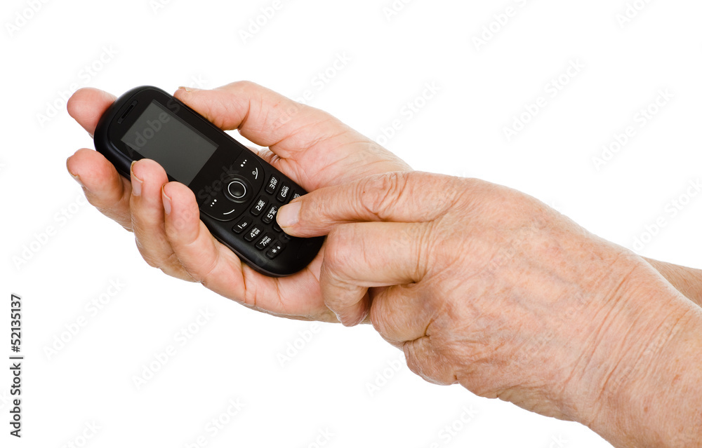 hands of the elderly person dial number on the cell phone hands of the elderly person dial number on the cell phone