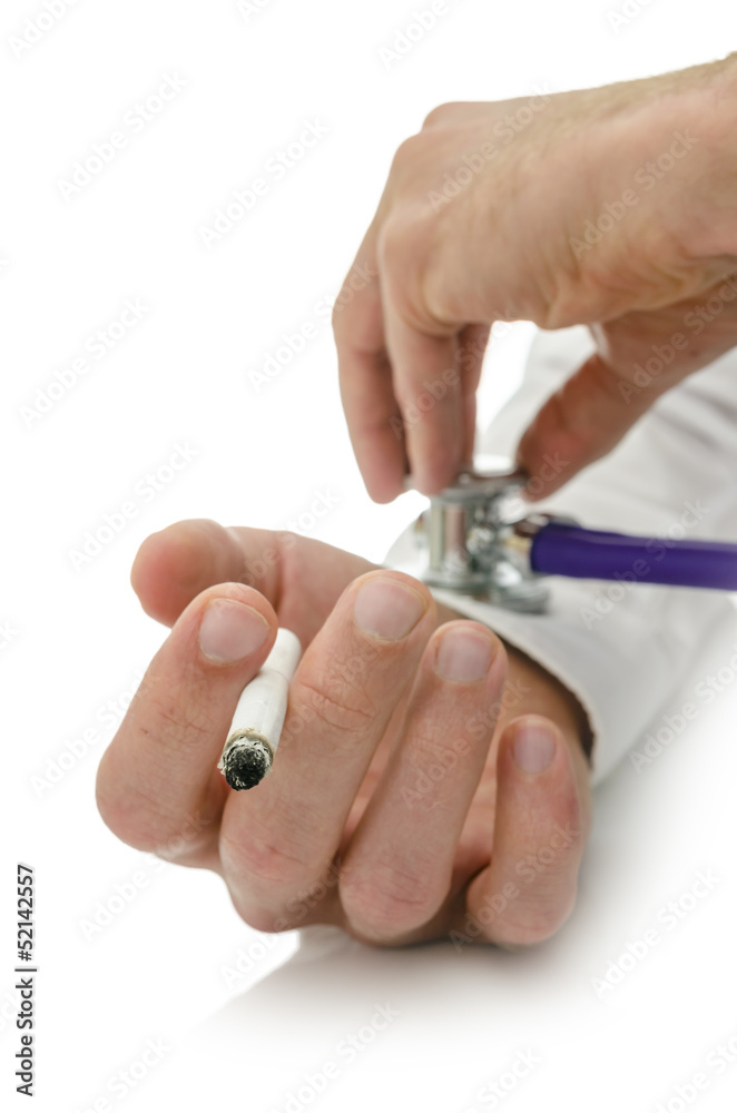 Holding stethoscope on cigarette addict hand