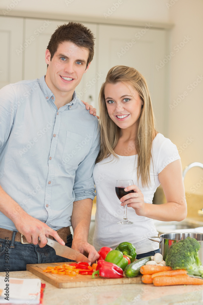 Smiling couple preparing dinner Smiling couple preparing dinner