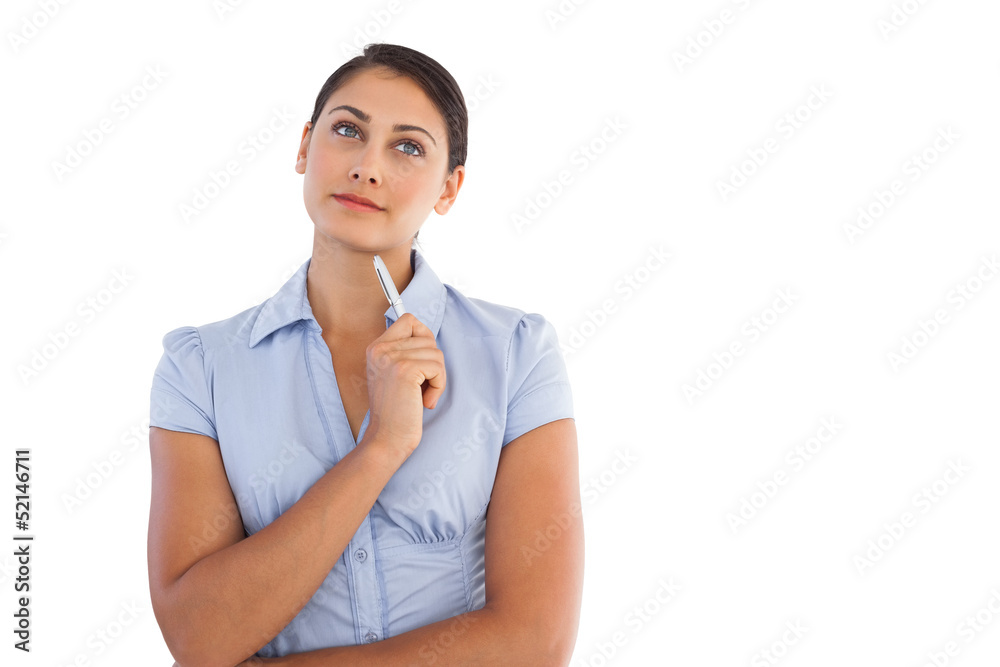 Thoughtful attractive businesswoman holding a pen Thoughtful attractive businesswoman holding a pen