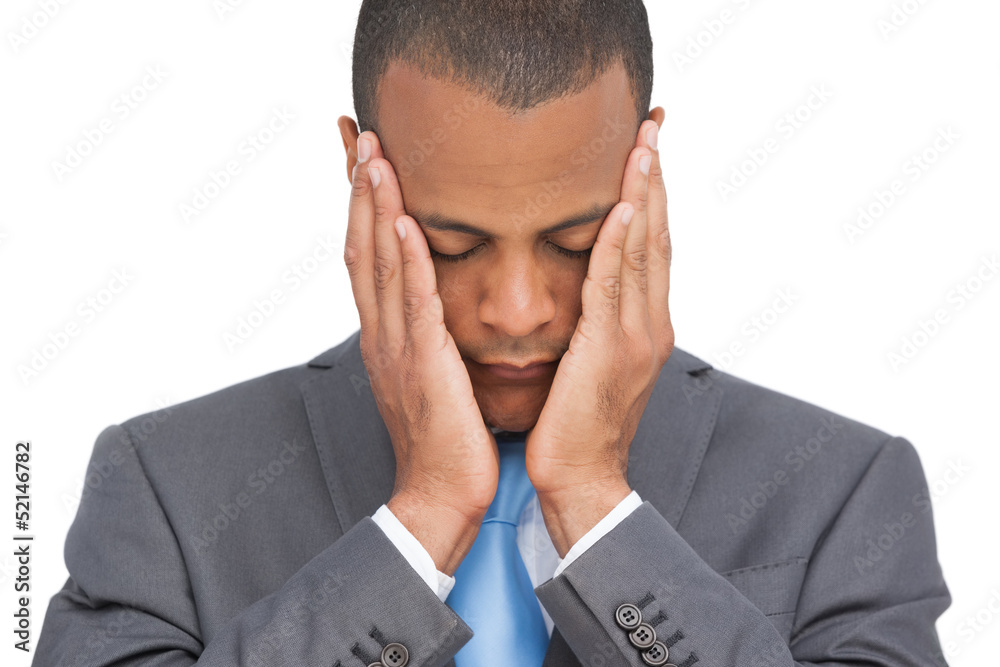 Stressed businessman holding her head between hands Stressed businessman holding her head between hands