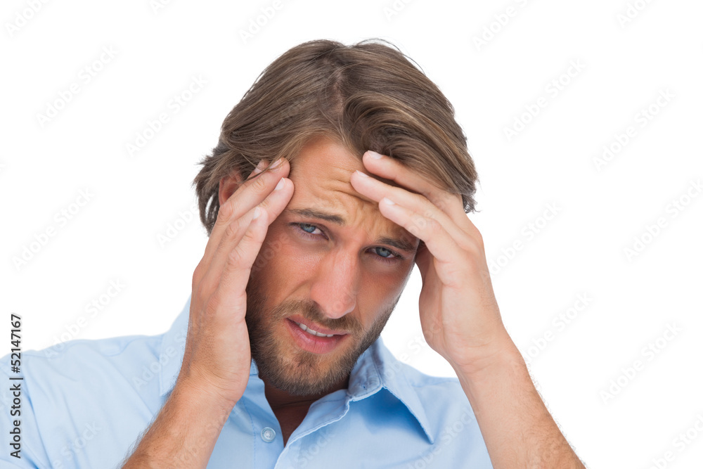Tanned man having a strong headache Tanned man having a strong headache