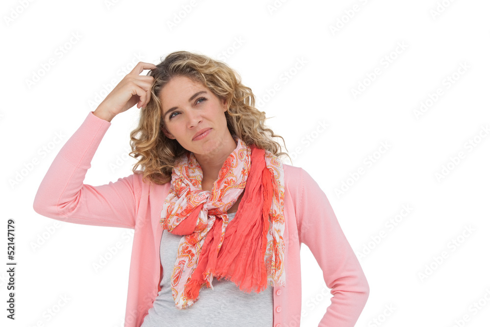 Attractive woman posing and smiling while scratching her head