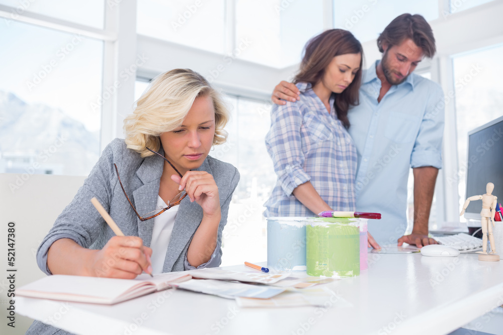 Designer is working in her bright office Designer is working in her bright office