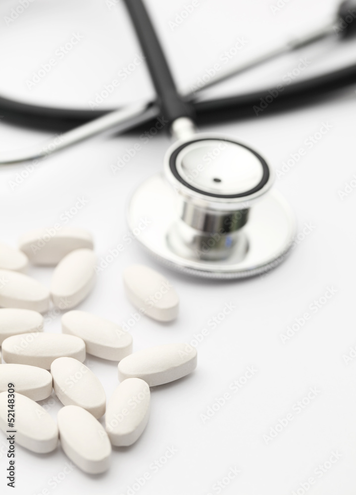 Stethoscope and pills Stethoscope and pills