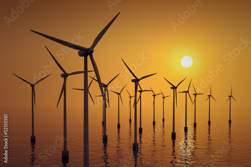 Floating wind turbines at sunset. photo