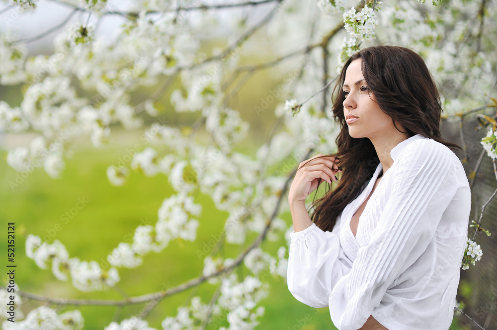 Beautiful woman portrait looking away in the meadow Beautiful woman portrait looking away in the meadow