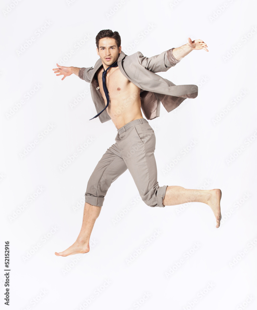 Handsome jumping man on suit isolated on a white background Handsome jumping man on suit isolated on a white background