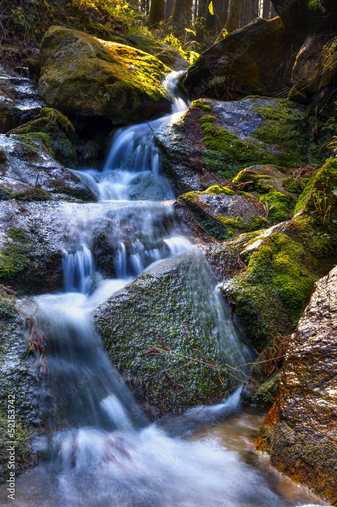 Fototapeta premium Mountain waterfall in autumn