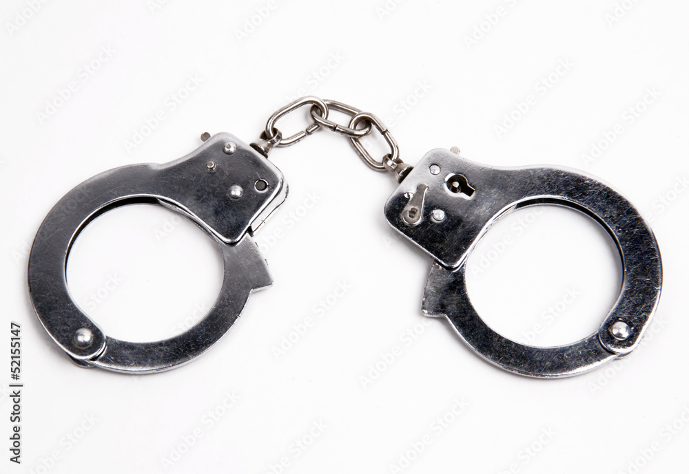 Law Enforcement Handcuffs Wrist Restraints on White Background Law Enforcement Handcuffs Wrist Restraints on White Background