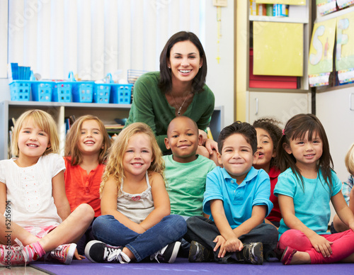 Group of Elementary Pupils In Classroom With Teacher