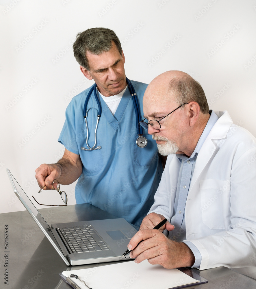 Two Senior Doctors at Laptop Conference Two Senior Doctors at Laptop Conference