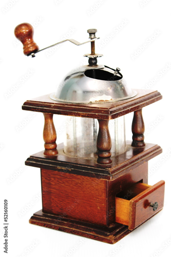 Coffee grinder by hand on a white background Coffee grinder by hand on a white background