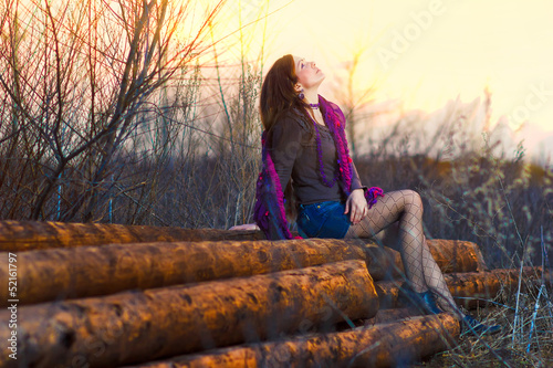 brunette sunlight girl sitting woman outside in a group timber p photo