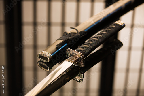Katana with sheath reversed laying on table
