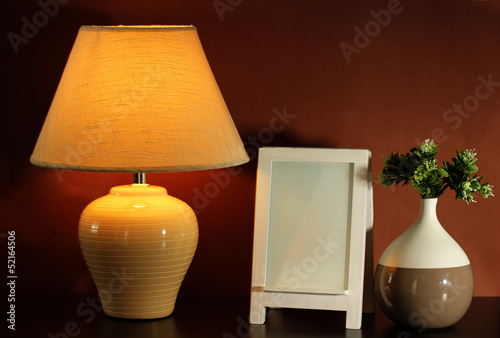 Fototapeta Naklejka Na Ścianę i Meble -  White photo frame and lamp
