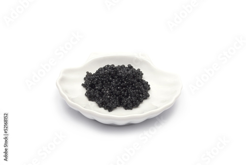 Caviar in shell saucer isolated on white