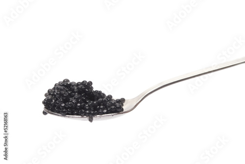 Caviar on spoon isolated on white