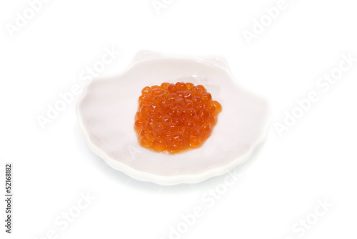 Red Caviar in shell saucer isolated on white