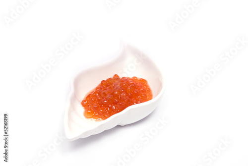 Red Caviar in shell saucer isolated on white