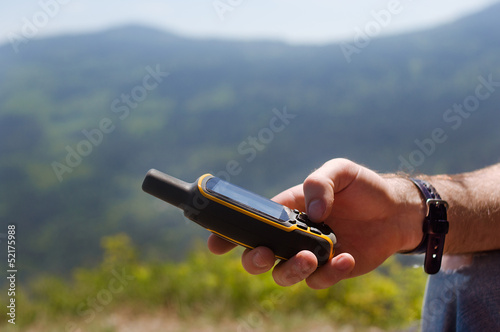Man holding in his hand GPS