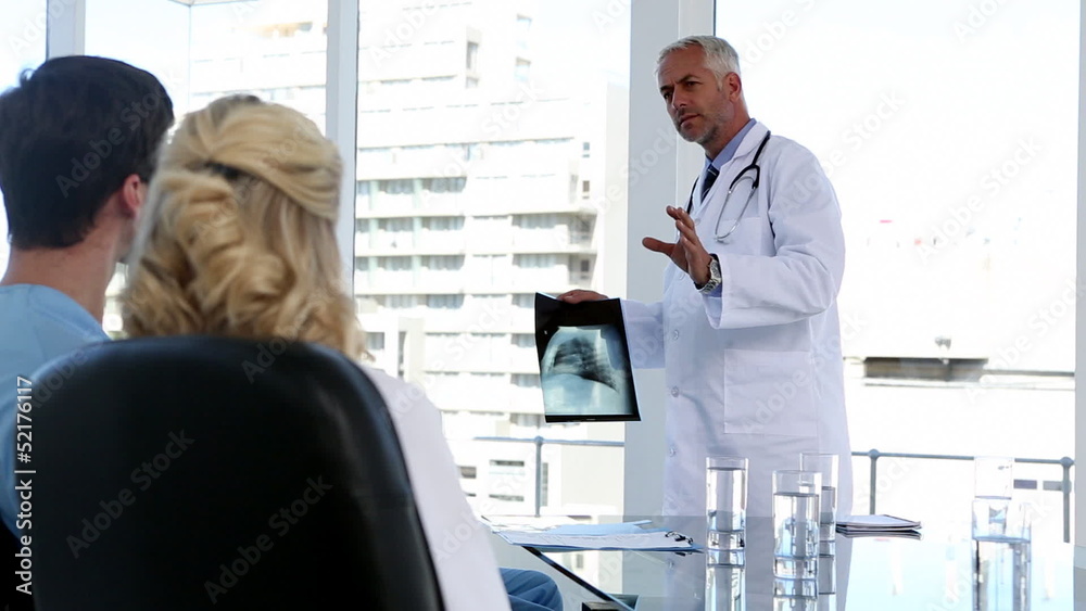Medical team looking at x-ray Medical team looking at x-ray