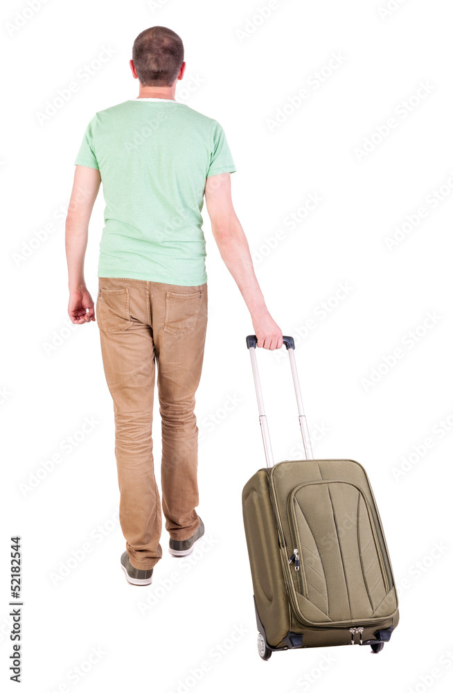 back view of walking  man  with suitcase