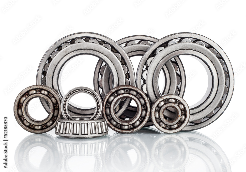 Composition of steel ball roller bearings on white background Composition of steel ball roller bearings on white background