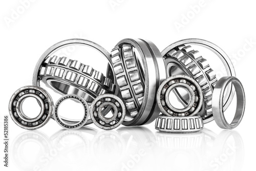 Composition of steel ball roller bearings  on white background