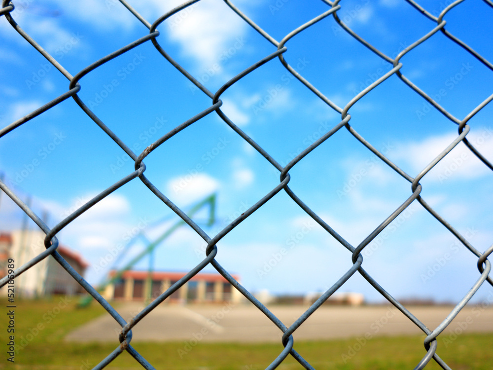 Metal mesh with blur basketball court background Metal mesh with blur basketball court background