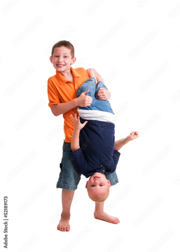 Two young brothers playing rough with each other. Two young brothers playing rough with each other.