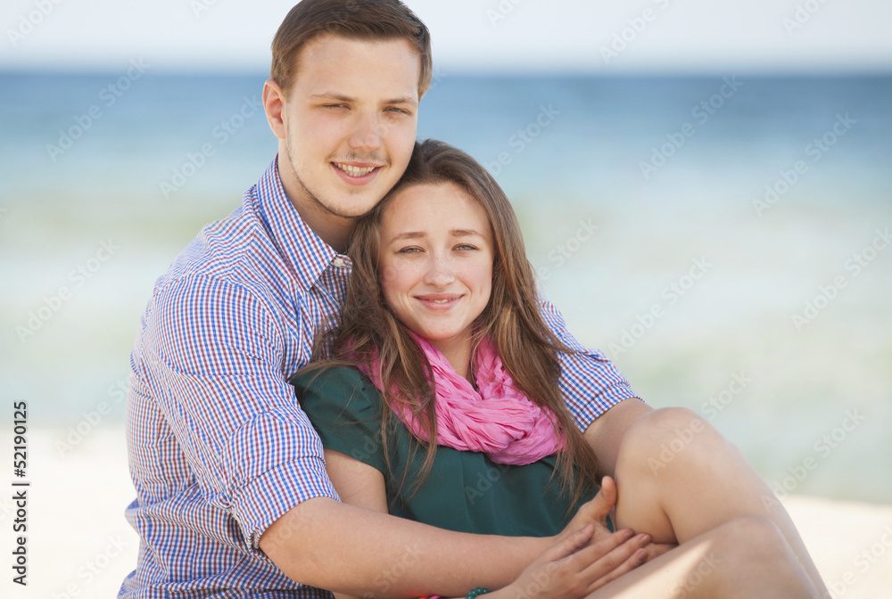 Portrait of young man and woman on a beach