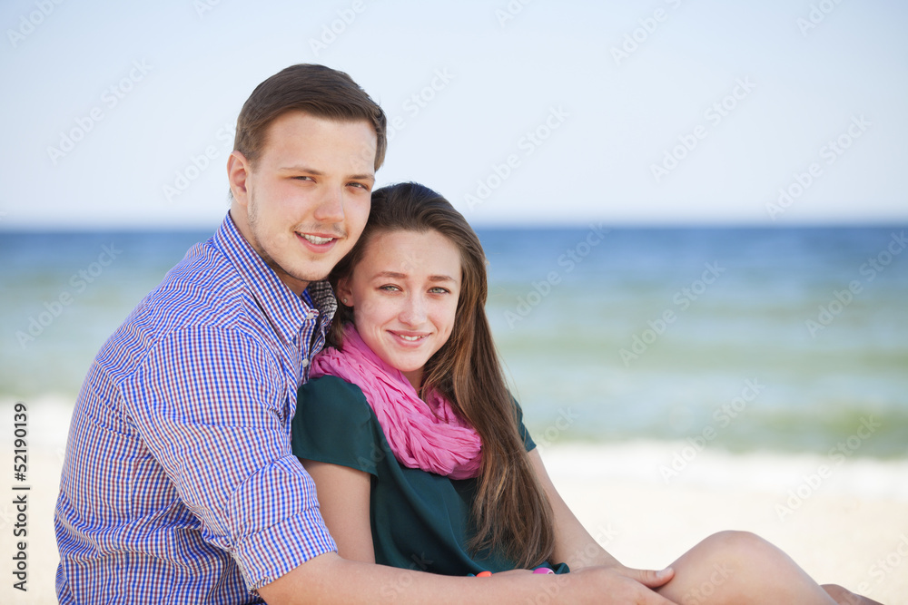 Portrait of young man and woman on a beach