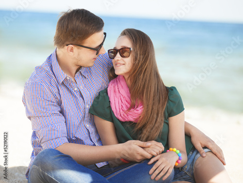 Portrait of young man and woman on a beach